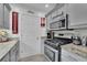 Updated kitchen with stainless steel appliances and gray cabinets at 1701 English Ivey Nw Ln, Kennesaw, GA 30144
