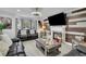 Cozy living room with a fireplace, a large TV, and comfortable seating at 1701 English Ivey Nw Ln, Kennesaw, GA 30144