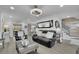 Open-concept living room with modern decor, a staircase, and access to the dining area at 1701 English Ivey Nw Ln, Kennesaw, GA 30144