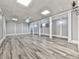Spacious basement features hardwood flooring, white support beams and columns, recessed lighting, and neutral walls at 5090 Eubanks Rd, Woodstock, GA 30188