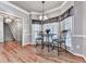 Cozy breakfast nook with bay window, elegant lighting, and hardwood flooring at 5090 Eubanks Rd, Woodstock, GA 30188