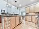 Spacious kitchen with wood cabinetry, granite countertops, and stainless appliances at 5090 Eubanks Rd, Woodstock, GA 30188