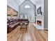 Cozy living room features vaulted ceilings, a fireplace, built-in shelving, and French doors to the exterior at 5090 Eubanks Rd, Woodstock, GA 30188