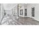Bright living room features hardwood floors, ceiling fans, and ample natural light at 5090 Eubanks Rd, Woodstock, GA 30188