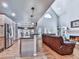 Open-concept living room and kitchen area with vaulted ceilings at 5090 Eubanks Rd, Woodstock, GA 30188