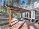 Pergola covering a brick patio and outdoor seating area at 5090 Eubanks Rd, Woodstock, GA 30188