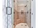 Tiled shower featuring a glass door and a corner bench at 5090 Eubanks Rd, Woodstock, GA 30188
