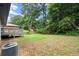 The spacious backyard offers lush greenery, a deck and privacy for outdoor activities at 569 Oakside Sw Dr, Atlanta, GA 30331