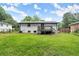 Lush green backyard with deck at 569 Oakside Sw Dr, Atlanta, GA 30331