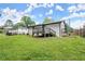 Spacious backyard and deck area perfect for outdoor entertaining and recreation at 569 Oakside Sw Dr, Atlanta, GA 30331