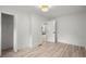 Modern bedroom featuring wood floors and an open door into an adjacent room at 569 Oakside Sw Dr, Atlanta, GA 30331