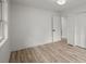 Spacious bedroom featuring modern floors, a closet, and a door to an adjacent room at 569 Oakside Sw Dr, Atlanta, GA 30331