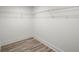 Walk-in closet featuring wire shelving, light wood floor, and white walls at 569 Oakside Sw Dr, Atlanta, GA 30331