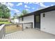 Backyard deck provides outdoor views of the brick and white painted home at 569 Oakside Sw Dr, Atlanta, GA 30331