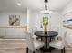 Dining area with seating for four and modern lighting at 569 Oakside Sw Dr, Atlanta, GA 30331