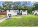 Charming one-story home featuring a well-maintained front yard and inviting entrance at 569 Oakside Sw Dr, Atlanta, GA 30331