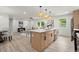 Kitchen island with sink and seating that opens up to the living room area at 569 Oakside Sw Dr, Atlanta, GA 30331
