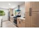 Modern kitchen with stainless steel appliances, light wood cabinets, and sleek hardware at 569 Oakside Sw Dr, Atlanta, GA 30331
