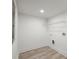 Simple laundry room design with white walls and convenient hookups for laundry appliances at 569 Oakside Sw Dr, Atlanta, GA 30331
