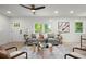 Inviting living space with elegant furnishings, a decorative rug, and a modern ceiling fan at 569 Oakside Sw Dr, Atlanta, GA 30331