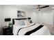 Spacious main bedroom featuring a modern ceiling fan, two windows, and a closet at 569 Oakside Sw Dr, Atlanta, GA 30331