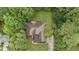 Aerial view of property and lush surroundings featuring mature trees, a manicured lawn, and backyard deck at 775 Tribble Cove Dr, Lawrenceville, GA 30045