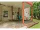 Covered back porch with outdoor seating, offering a relaxing space at 775 Tribble Cove Dr, Lawrenceville, GA 30045