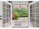 Enjoy the view of your private back yard through the french doors to the patio, lawn and wooded back yard at 775 Tribble Cove Dr, Lawrenceville, GA 30045