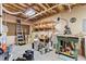 Functional basement with exposed ceiling, work table, and storage options at 775 Tribble Cove Dr, Lawrenceville, GA 30045