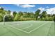 Outdoor basketball court surrounded by trees at 775 Tribble Cove Dr, Lawrenceville, GA 30045