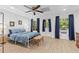 Comfortable bedroom with natural light, blue bedding, and a decorative ceiling at 775 Tribble Cove Dr, Lawrenceville, GA 30045