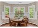 Charming breakfast nook with abundant natural light, perfect for enjoying meals with a view of the outdoors at 775 Tribble Cove Dr, Lawrenceville, GA 30045