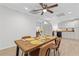 Cozy dining room and open kitchen concept featuring a view of the backyard and modern recessed lighting at 775 Tribble Cove Dr, Lawrenceville, GA 30045