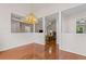 Spacious dining room with hardwood floors, featuring an open design that enhances the flow of the home at 775 Tribble Cove Dr, Lawrenceville, GA 30045