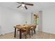 This dining room features a classic wood table, seating for four, recessed lighting and views of the backyard at 775 Tribble Cove Dr, Lawrenceville, GA 30045