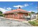 Charming brick building with a red roof, offering lessons and concerts, set against a blue sky at 775 Tribble Cove Dr, Lawrenceville, GA 30045