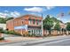 The Blue Rooster Bake Shop & Eatery corner building with brick exterior and outdoor seating at 775 Tribble Cove Dr, Lawrenceville, GA 30045