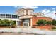 Shot of Infinite Energy Theater with brick construction, stairs leading to entrance, and lush landscaping at 775 Tribble Cove Dr, Lawrenceville, GA 30045