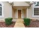 Inviting front entrance with a wooden door and manicured shrubbery at 775 Tribble Cove Dr, Lawrenceville, GA 30045