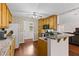 Functional kitchen with wooden cabinets, granite countertops, and stainless steel appliances, ideal for cooking and meal preparation at 775 Tribble Cove Dr, Lawrenceville, GA 30045