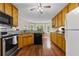 Well-equipped kitchen with stainless steel appliances, wooden cabinets, and granite countertops, providing a modern and practical space at 775 Tribble Cove Dr, Lawrenceville, GA 30045