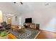 Comfortable living room featuring hardwood floors and vaulted ceiling at 775 Tribble Cove Dr, Lawrenceville, GA 30045