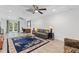This living room boasts lots of natural light, recessed lighting, wood-look floors, ceiling fan and a cozy sofa at 775 Tribble Cove Dr, Lawrenceville, GA 30045