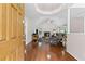Cozy living room featuring hardwood floors and a fireplace with stone surround at 775 Tribble Cove Dr, Lawrenceville, GA 30045