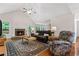 Bright living room with a stone fireplace and vaulted ceiling at 775 Tribble Cove Dr, Lawrenceville, GA 30045