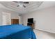 This main bedroom has a bed with blue bedding, a television, and carpet flooring at 775 Tribble Cove Dr, Lawrenceville, GA 30045