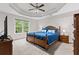 This is a spacious main bedroom with tray ceiling and carpet flooring at 775 Tribble Cove Dr, Lawrenceville, GA 30045