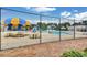 Gathering-friendly pool area with colorful umbrellas, slides and picnic tables at 775 Tribble Cove Dr, Lawrenceville, GA 30045