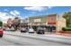 Street view showing various retail stores with cars parked along the curb at 775 Tribble Cove Dr, Lawrenceville, GA 30045