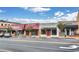 Street view of commercial buildings including a florist and an upscale boutique on a sunny day at 775 Tribble Cove Dr, Lawrenceville, GA 30045